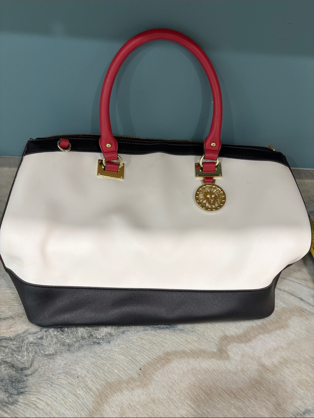 Two-Tone Tote with Red Handles and Gold Medallion